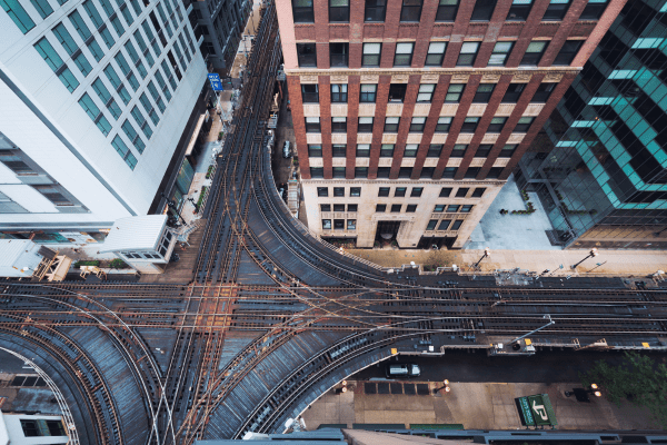 an aerial view of a railroad crossing in a city